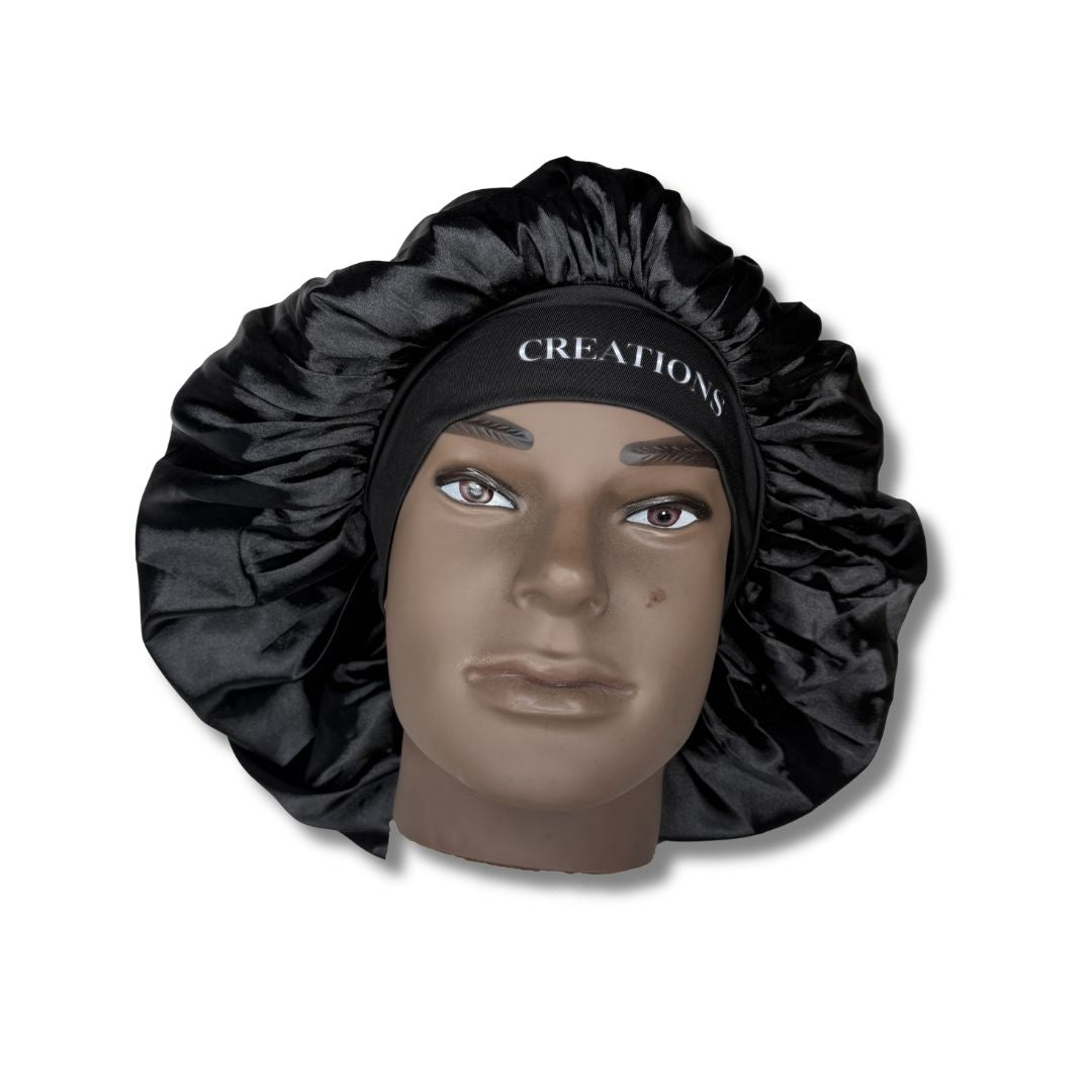 Black satin bonnet on a mannequin head with 'Creations' branding.