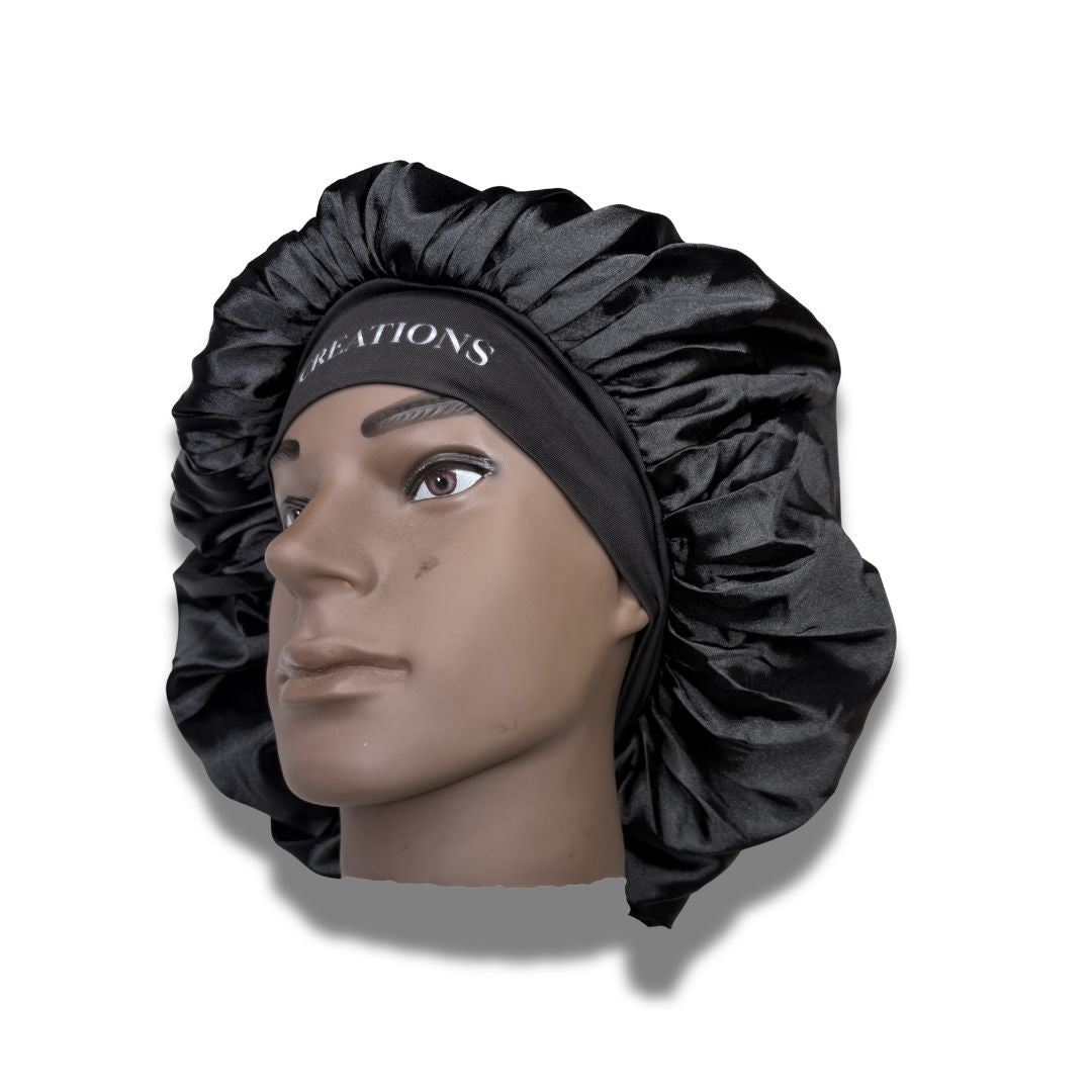 Black satin bonnet on a mannequin head with 'Creations' branding.
