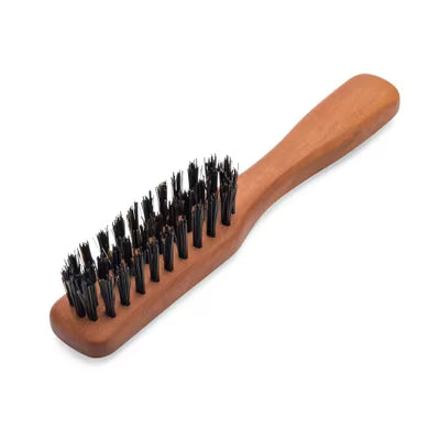 Wooden brush with black bristles on a white background