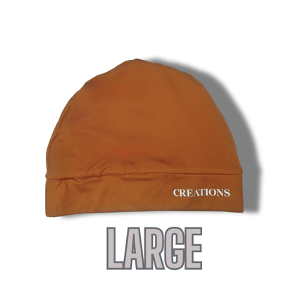 Brown beanie with white 'CREATIONS' logo on a white background
