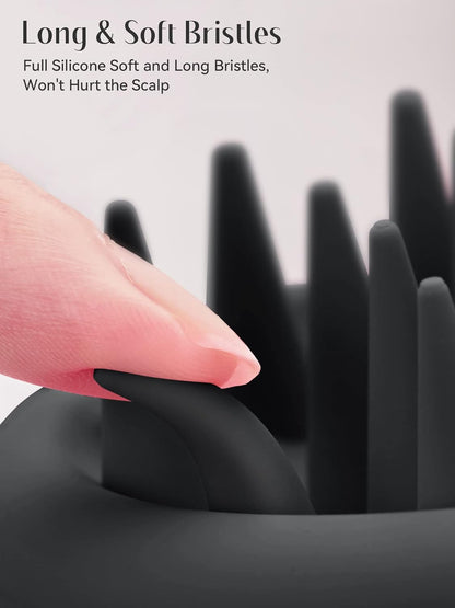 Black hairbrush with long, soft bristles being held by a hand.